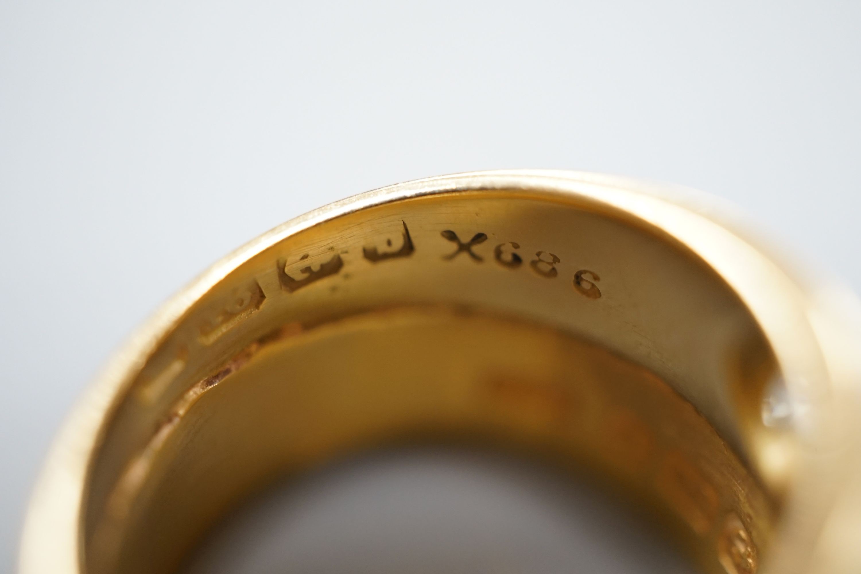 A 22ct gold band, welded to an 18ct gold and diamond set band, size L, gross weight 8.3 grams.